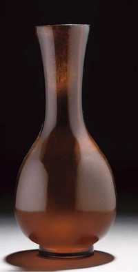 18th/19th Century A translucent amber glass bottle vase